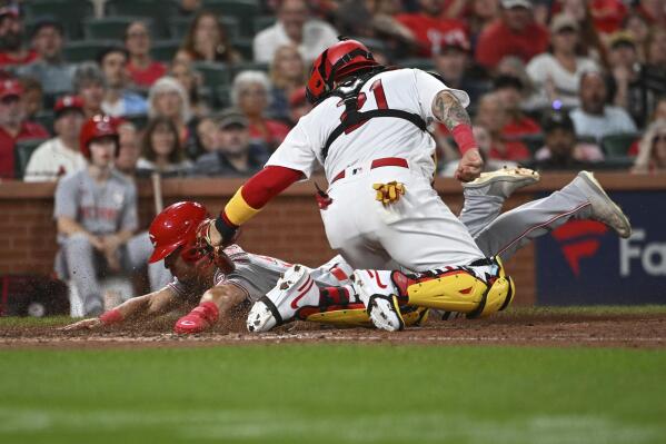 St. Louis Cardinals catcher Yadier Molina runs into Cincinnati