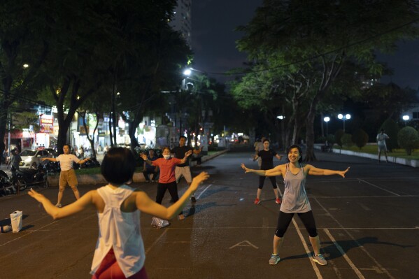 People exercise at a park in Ho Chi Minh City, Vietnam, Jan. 11, 2024. (AP Photo/Jae C. Hong)