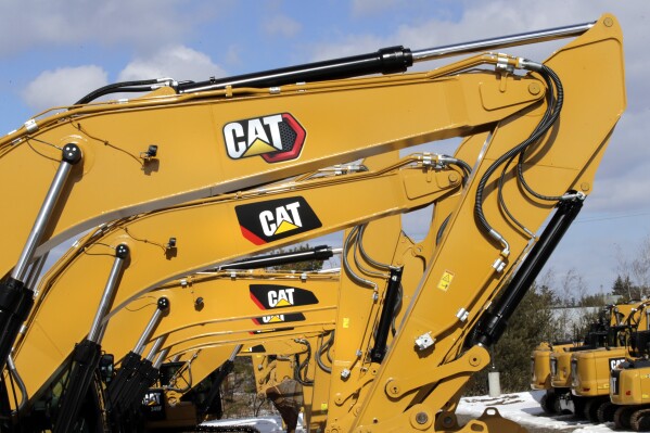 FILE - Excavator booms, adorned with the Caterpillar Inc. "CAT" logo, are displayed at the Milton CAT dealership in Londonderry, N.H., Feb. 20, 2020. On Friday, July 12, 2024, the Labor Department releases producer prices data for June, 2024. (ĢӰԺ Photo/Charles Krupa, File)