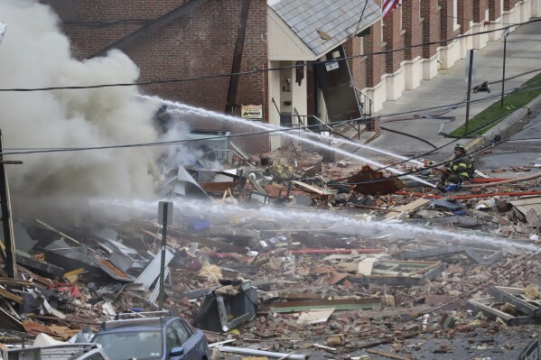 FILE - Emergency personnel work at the site of a deadly explosion at a chocolate factory, March 24, 2023, in West Reading, Pa. Federal safety investigators issued a subpoena to Pennsylvania’s public utility regulator on Monday, Sept. 18, for documents related to the fatal explosion at a chocolate factory, saying the state agency has been uncooperative. (Jeff Doelp/Reading Eagle via AP, File)