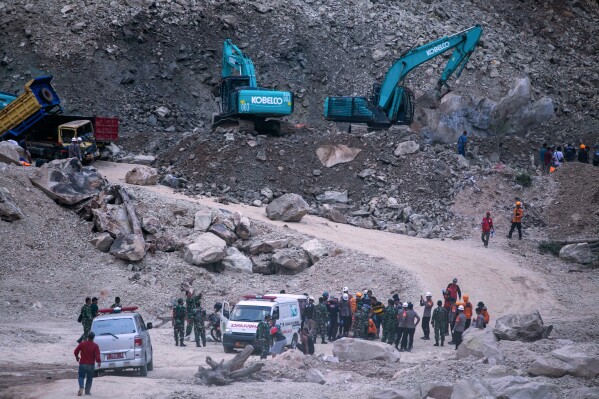 Rescuers search for victims after a natural stones quarry collapsed in Cirebon district , West Java province, Indonesia, Friday, 30, 2025. (AP Photo/Okri Riyana)