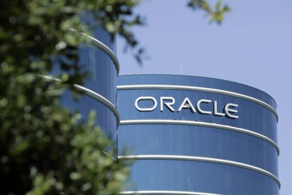 FILE - This June 26, 2007 file photo shows the exterior of Oracle Corp. headquarters in Redwood City, Calif. Oracle Corp.'s planned campus in Nashville, Tenn. will serve as the computer technology giant's world headquarters, placing it in a city that's a center of the health care industry, CEO Larry Ellison said. (AP Photo/Paul Sakuma, File)