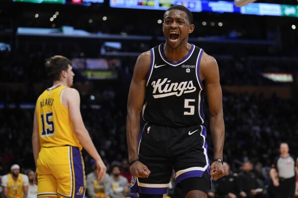 Sacramento Kings guard De'Aaron Fox celebrates after scoring during the second half of an NBA basketball game against the Los Angeles Lakers, Wednesday, March 6, 2024, in Los Angeles. (AP Photo/Marcio Jose Sanchez)