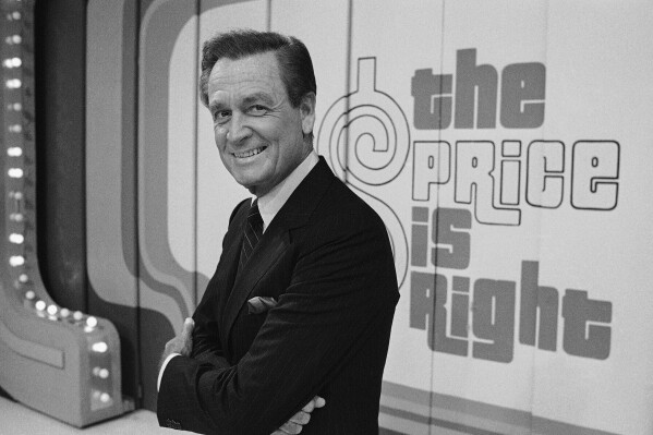 FILE - Television host Bob Barker appears on the set of his show, "The Price is Right" in Los Angeles on July 25, 1985. CBS says it will air a tribute on Thursday to Barker, who died at age 99 last weekend at his home in Los Angeles. “The Price is Right: A Tribute to Bob Barker,” scheduled for 8 p.m. Eastern and Pacific, will be replayed Labor Day in the game show's regular daytime slot. (AP Photo/Lennox McLendon, File)