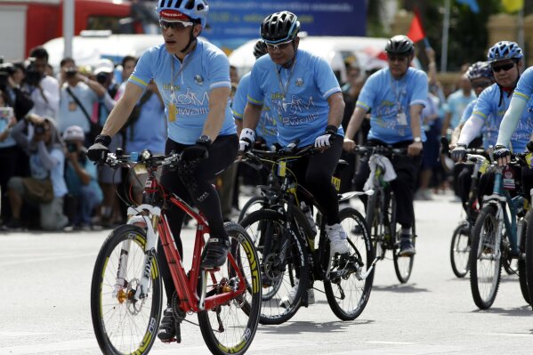 
              FILE - In this Aug. 16, 2015, file photo, Thai Crown Prince Vajiralongkorn leads "Bike for Mom" participants in Bangkok, Thailand. Ahead of the formal coronation of Thailand's King Maha Vajiralongkorn, what he will do with the power and influence of his status is still not clear. (AP Photo/Sakchai Lalit, File)
            