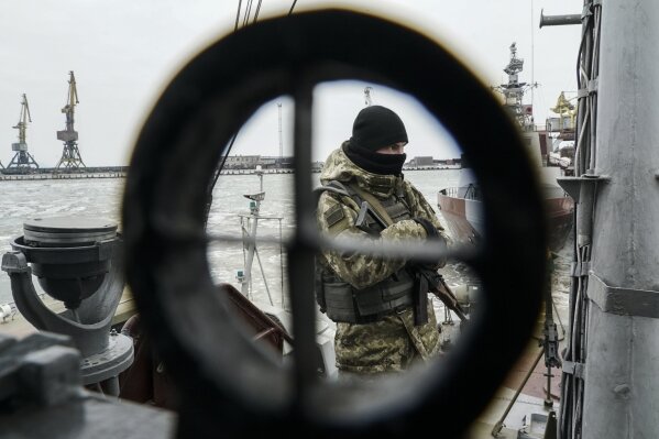 
              A Ukrainian serviceman stands on board a coast guard ship in the Sea of Azov port of Mariupol, eastern Ukraine, Monday, Dec. 3, 2018. The Ukrainian military has been on increased readiness as part of martial law introduced in the country in the wake of the Nov. 25, 2018 incident in the Sea of Azov, in which the Russian coast guard fired upon and seized three Ukrainian navy vessels along with their crews. (AP Photo/Evgeniy Maloletka)
            