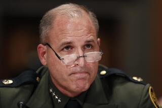 FILE - In this Nov. 30, 2016, file photo, Customs and Border Protection U.S. Border Patrol Chief Mark Morgan listens as he testifies during a hearing of the Senate Committee on Homeland Security and Governmental Affairs on Capitol Hill in Washington. Morgan said he was asked to leave and decided to resign on Jan. 26, 2017, rather than fight the request, according to a U.S. official who was on brief video conference in which Morgan informed senior agents of the change. (AP Photo/Alex Brandon)