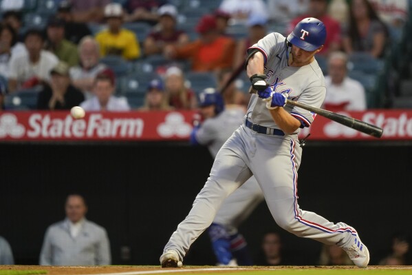 Rangers back Gray with 3 straight homers, beat Angels 5-1 to