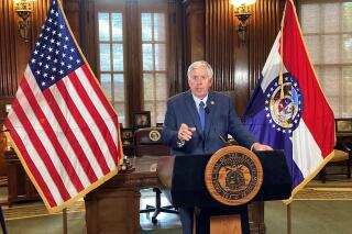 Missouri Gov. Mike Parson speaks to reporters on Monday, Aug. 22, 2022, at his Capitol office in Jefferson City while announcing that he is calling a special legislative session to consider an income tax cut. Parson said the tax is affordable because of a record state surplus. He said the special session will begin Sept. 6. (AP Photo/David A. Lieb)