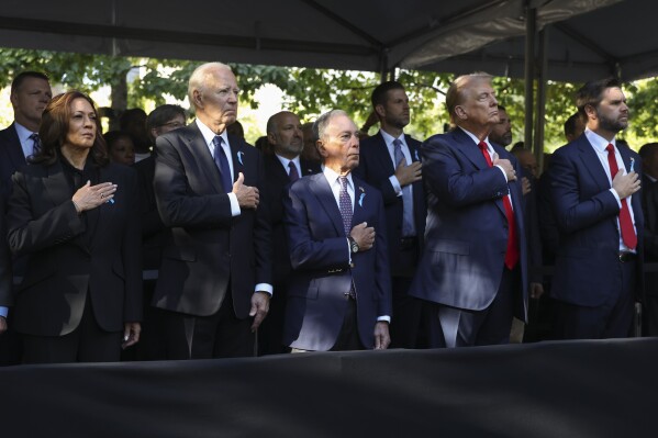 Politics tamfitronics From left, Democratic presidential nominee Vice President Kamala Harris, President Joe Biden, Michael Bloomberg, Republican presidential nominee former President Donald Trump and Republican vice presidential nominee Sen. JD Vance, R-Ohio, attend the 9/11 Memorial ceremony on the 23rd anniversary of the Sept. 11, 2001 attacks, Wednesday, Sept. 11, 2024, in New York. (AP Photo/Yuki Iwamura)