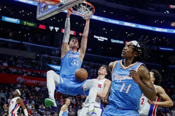 Los Angeles Clippers center Isaiah Hartenstein (55) dunks against the Detroit Pistons during the second half of an NBA basketball game Friday, Nov. 26, 2021, in Los Angeles. The Clippers won 107-96. (AP Photo/Ringo H.W. Chiu)