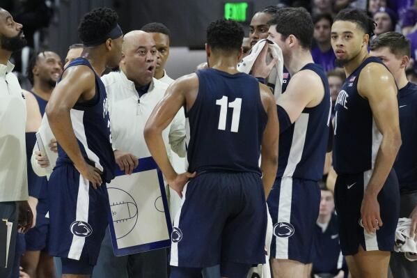 Penn State coach Micah Shrewsberry, second from left, talks to players during overtime in the team's NCAA college basketball game against Northwestern in Evanston, Ill., Wednesday, March 1, 2023. Penn State won 68-65. (AP Photo/Nam Y. Huh)