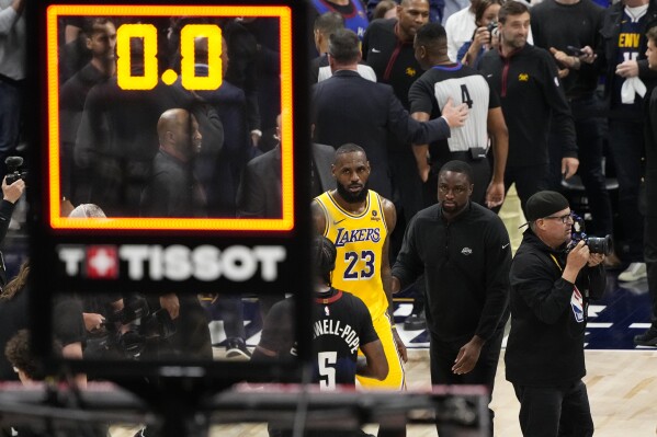 Los Angeles Lakers forward LeBron James (23) walks off the court after a loss to the Denver Nuggets in Game 2 of an NBA basketball first-round playoff series Monday, April 22, 2024, in Denver. (AP Photo/Jack Dempsey)