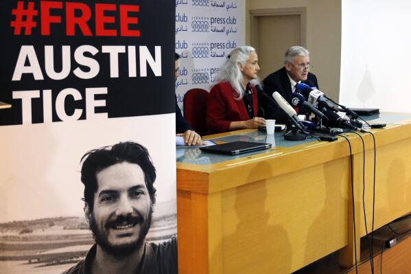FILE - Marc and Debra Tice, the parents of Austin Tice, who is missing in Syria for nearly six years, speak during a press conference, at the Press Club, in Beirut, Lebanon, Dec. 4, 2018. President Joe Biden says he's meeting with the parents of American journalist Austin Tice, who went missing in Syria 10 years ago. The meeting with Marc and Debra Tice is expected to take place at the White House. Debra Tice was introduced Saturday night as being in attendance at the White House Correspondents’ Association Dinner.  (AP Photo/Bilal Hussein, File)