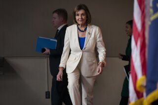 Speaker of the House Nancy Pelosi, D-Calif., arrives to talk to reporters as the House Intelligence Committee holds public impeachment hearings of President Donald Trump's efforts to tie U.S. aid for Ukraine to investigations of his political opponents. Pelosi says there is clear evidence that President Donald Trump has used his office for his personal gain. She says doing that "undermined the national security of the United States." (AP Photo/J. Scott Applewhite)