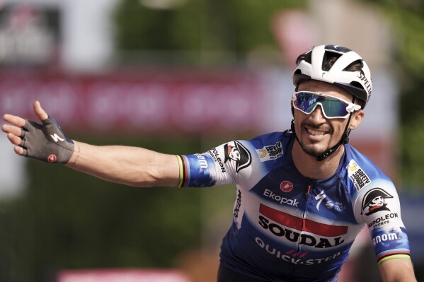 France's Julian Alaphilippe celebrates winning the 12th stage of the Giro d'Italia cycling race from Martinsicuro to Fano, Italy, Thursday, May 16, 2024. (Massimo Paolone/LaPresse via AP)