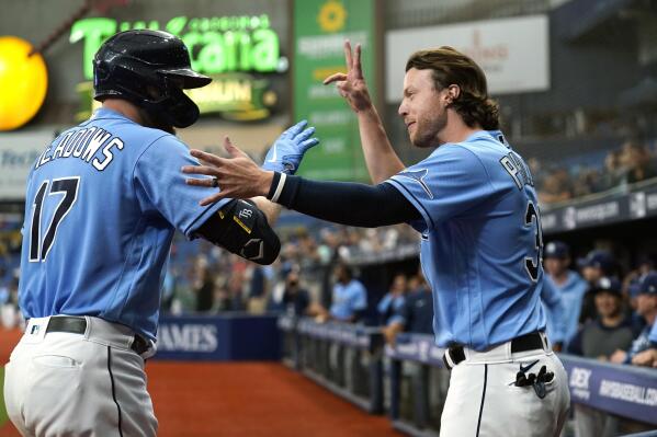 Tampa Bay Rays' Austin Meadows (17) celebrates his solo home run against the New York Yankees with Brett Phillips during the sixth inning of a baseball game Thursday, July 29, 2021, in St. Petersburg, Fla. (AP Photo/Chris O'Meara)