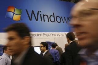 FILE - In this Jan. 11, 2010 file photo, a display for Microsoft's Windows 7 is shown at the National Retail Federation's convention in New York. Users still running Microsoft's Windows 7, on their computer's might be at risk. Microsoft is no longer providing free security updates for the system as of Tuesday, Jan. 14, 2020, meaning computers using it will be more vulnerable to viruses and malware.  Users who want to protect their data need to upgrade to Windows 10. (AP Photo/Mark Lennihan, File)