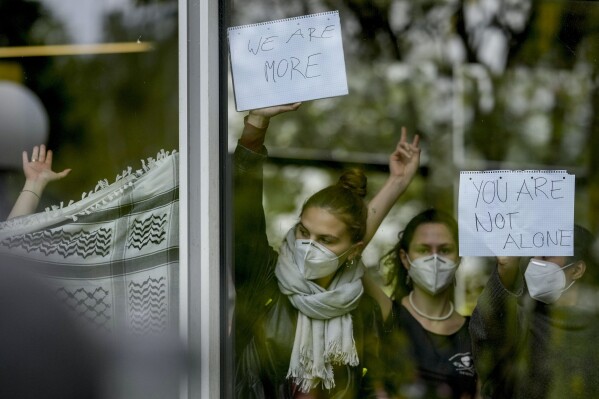 Protesters are seen during a pro-Palestinians demonstration by the group "Student Coalition Berlin" in the theater courtyard of the 'Freie Universität Berlin' university in Berlin, Germany, Tuesday, May 7, 2024. Pro-Palestinian activists occupied a courtyard of the Free University in Berlin on Tuesday. (AP Photo/Markus Schreiber)