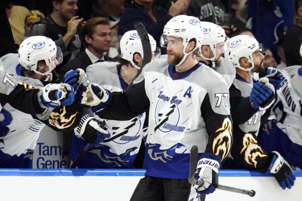 Tampa Bay Lightning defenseman Victor Hedman (77) celebrates with the bench after scoring against the Boston Bruins during the third period of an NHL hockey game Thursday, Jan. 26, 2023, in Tampa, Fla. (AP Photo/Chris O'Meara)