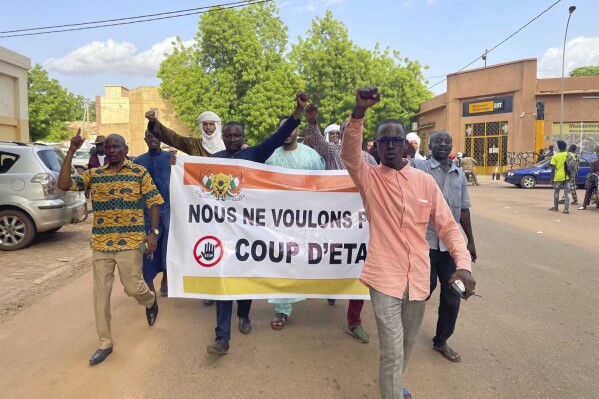 Supporters of Nigerien President Mohamed Bazoum demonstrate in his support in Niamey, Niger, Wednesday July 26, 2023. Governing bodies in Africa condemned what they characterized as a coup attempt Wednesday against Niger's president, whose official Twitter account reported that elements of the presidential guard engaged in an 