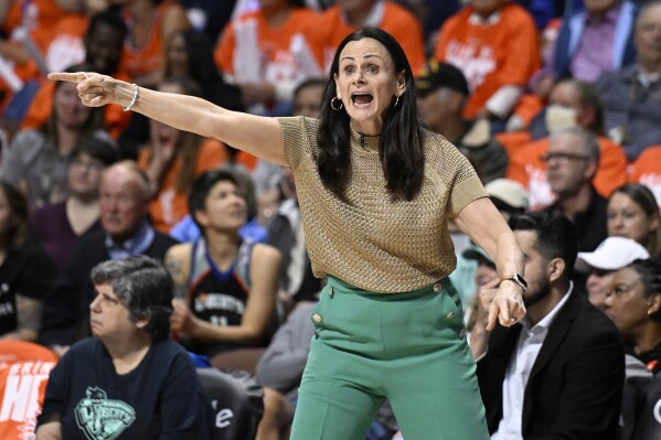 New York Liberty head coach Sandy Brondello gestures during the first half of Game 3 of the team's WNBA basketball semifinal playoff series against the Connecticut Sun, Friday, Sept. 29, 2023, in Uncasville, Conn. (AP Photo/Jessica Hill)