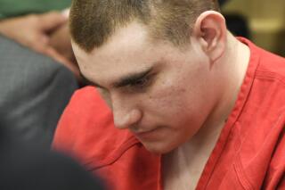 FILE - In this June 8, 2018, file photo, school shooting suspect Nikolas Cruz sits in the Broward County courthouse in Fort Lauderdale, Fla. In a motion filed Thursday, July 8, 2021, attorneys for Cruz, accused of killing 17 people at a Florida high school in 2018, want a judge to close all future hearings to the media and the public to ensure a fair trial. (Taimy Alvarez/South Florida Sun-Sentinel via AP, Pool, File)