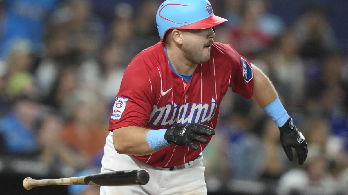 Miami Marlins' Jake Burger celebrates his home run during the