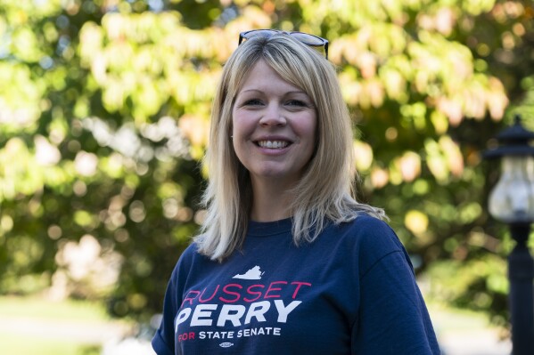 Virginia state Senate candidate Russet Perry, joins campaign volunteers during a campaign stop in the Cascades area of Sterling, Va., Sept. 16, 2023. Democratic candidate Perry, a prosecutor and former CIA officer, is running for a seat that could decide control of the Virginia state Senate in November. Saturday, Sept. 16, 2023. (AP Photo/Manuel Balce Ceneta)