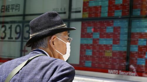A person looks at an electronic stock board showing Japan's stock prices at a securities firm Thursday, June 8, 2023, in Tokyo. Asian shares fell on Thursday after heavy selling in major technology stocks pushed benchmarks down on Wall Street. (AP Photo/Eugene Hoshiko)