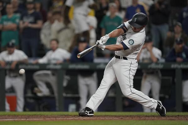 Seattle Mariners' Kyle Seager hits a single to drive in the winning run in the ninth inning of the team's baseball game against the Tampa Bay Rays, Thursday, June 17, 2021, in Seattle. The Mariners won 6-5. (AP Photo/Ted S. Warren)