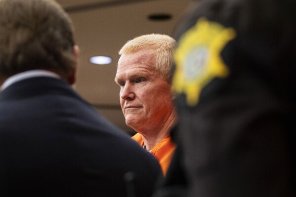 Alex Murdaugh, convicted of killing his wife, Maggie, and younger son, Paul, in June 2021, is escorted into the courtroom for a hearing on the motion for a retrial, Tuesday, Jan. 16, 2024, at the Richland County Judicial Center, in Columbia, S.C. (Gavin McIntyre/The Post and Courier via AP, Pool)