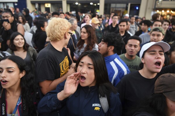 FILE - Protesters shout before a speaking engagement by Ben Shapiro on the campus of the University of California Berkeley in Berkeley, Calif., Sept. 14, 2017. New polling finds that America’s college campuses are seen as far friendlier to liberals than to conservatives when it comes free speech. Polling from the University of Chicago and the AP-NORC Center for Public Affairs Research finds that 47% of adult Americans say liberals are free to express their views on college campuses, while 20% said the same of conservatives. (AP Photo/Josh Edelson, File)