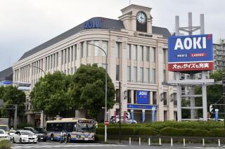 FILE - This photo shows the headquarters of Aoki Holdings Inc., a clothing company, in Yokohama, near Tokyo Wednesday, Aug. 17, 2022. The first verdicts in the sprawling Tokyo Olympic bribery scandal were handed down Friday, April 21, 2023, in Tokyo District Court with defendants found guilt but avoiding jail time. (Kyodo News via AP, File)