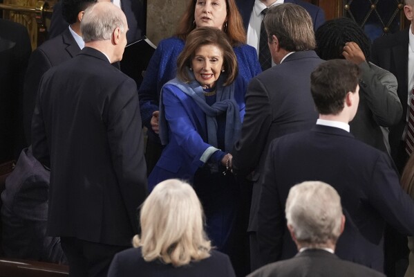 Rep. Nancy Pelosi, D-Calif., center, is greeted upon arrival as the House of Representatives meets to elect a speaker and convene the new 119th Congress at the Capitol in Washington, Friday, Jan. 3, 2025. (AP Photo/Jacquelyn Martin)