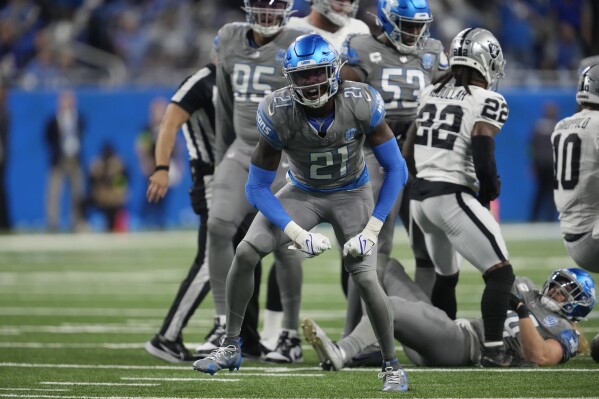 Detroit Lions safety Tracy Walker III (21) reacts after sacking Las Vegas Raiders quarterback Jimmy Garoppolo (10) during the second half of an NFL football game, Monday, Oct. 30, 2023, in Detroit. (AP Photo/Paul Sancya)