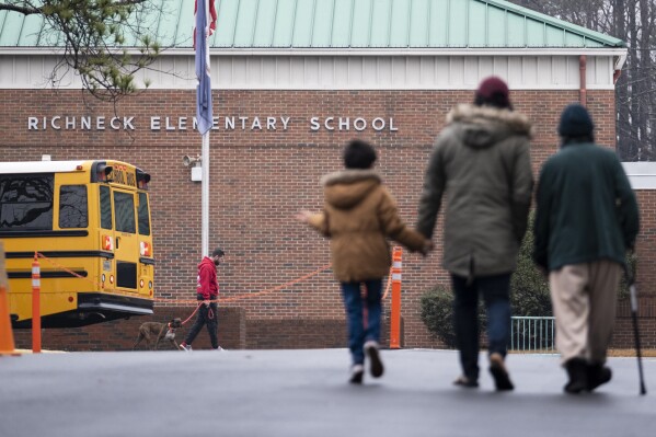 FILE - Students return to Richneck Elementary School in Newport News, Va., Jan. 30, 2023. Lawyers in Newport News will argue, Friday, Oct. 27, 2023, over whether a teacher at Richneck who was shot by her 6-year-old student should receive only workers’ compensation for her injuries. (Billy Schuerman/The Virginian-Pilot via AP, File)