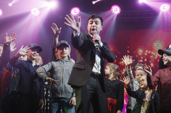 
              FILE In this file photo taken on Friday, March 29, 2019, Volodymyr Zelenskiy, Ukrainian actor and candidate in the upcoming presidential election, hosts a comedy show at a concert hall in Brovary, Ukraine. For his presidential campaign popular Ukrainian comedian Volodymyr Zelenskiy has literally taken the script from a TV show in which he plays the Ukrainian president. (AP Photo/Efrem Lukatsky, File)
            