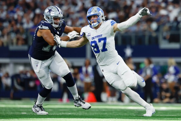 Detroit Lions defensive lineman Aidan Hutchinson (97) rushes against Terence Steele (78) during an NFL football game against the Dallas Cowboys on Sunday, Oct. 13, 2024, in Arlington, Texas. (AP Photo/Matt Patterson, File)