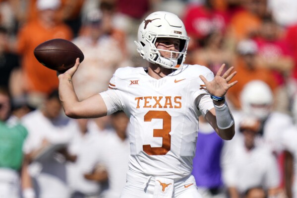 Texas quarterback Quinn Ewerslooks to throw a pass during the first half of an NCAA college football game against Houston, Saturday, Oct. 21, 2023, in Houston. (AP Photo/Eric Christian Smith)