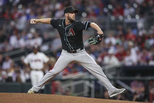 Arizona Diamondbacks pitcher Merrill Kelly delivers in the second inning of a baseball game against the Atlanta Braves, Wednesday, June 4, 2025, in Atlanta. (AP Photo/Colin Hubbard)