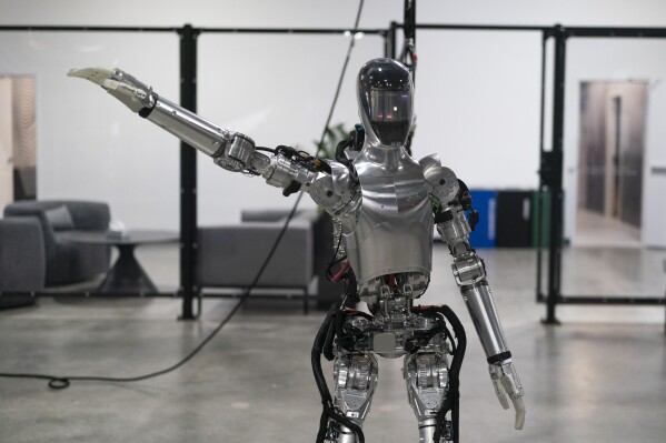 Humanoid robot Figure 01 is demonstrated at Figure AI's test facility in Sunnyvale, Calif., Tuesday, Oct. 3, 2023. "If we can just get humanoids to do work that humans are not wanting to do because there's a shortfall of humans, we can sell millions of humanoids, billions maybe", said Figure AI CEO Brett Adcock. (AP Photo/Jae C. Hong)