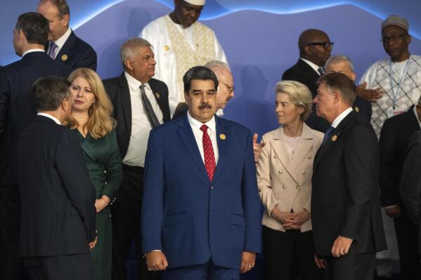 FILE - Venezuela's President Nicolas Maduro, center, stands next to the President of the European Commission Ursula von der Leyen, center right, as leaders prepare themselves for a group photo at the COP27 U.N. Climate Summit in Sharm el-Sheikh, Egypt, Nov. 7, 2022. (AP Photo/Nariman El-Mofty, File)