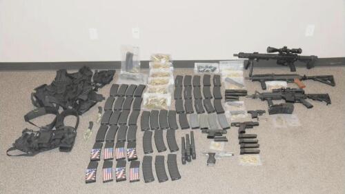 This photo released by the North Dakota Bureau of Criminal Investigation on Wednesday, July 19, 2023, shows the cache of weapons and ammunition that authorities recovered from the car of a man who opened fire on Fargo, N.D., police officers on Friday, July 14. One officer, Jake Wallin, was killed and two others were injured before a fourth officer shot and killed 37-year-old Mohamad Barakat. (North Dakota Bureau of Criminal Investigation via AP)