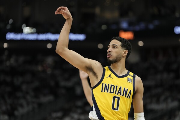 Indiana Pacers' Tyrese Haliburton reacts to his three pointer during the second half of Game 2 of the first round NBA playoff basketball series against the Milwaukee Bucks Tuesday, April 23, 2024, in Milwaukee.The Pacers won 125-108 to tie the series 1-1. (AP Photo/Morry Gash)