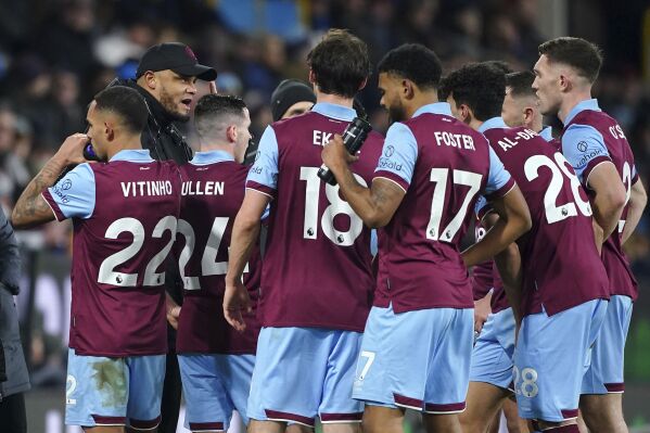 Burnley manager Vincent Kompany addresses his team during their English Premier League soccer match against Luton Town at Turf Moor, Burnley, England, Friday, Jan. 12, 2024. (Peter Byrne/PA via AP)