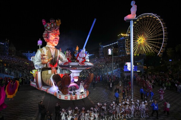 A carnival float depicting a king parades through Place Massena during the opening ceremony of 151st edition of the Nice Carnival in Nice, southern France, Saturday, Feb. 17, 2024. (APPhoto/Daniel Cole)