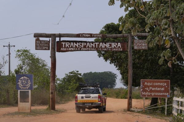 A fire department truck enters the Transpantaneira, also known as MT-060, a road that crosses the Pantanal wetlands, near Pocone, Mato Grosso state, Brazil, Saturday, Nov. 18, 2023. (AP Photo/Andre Penner)