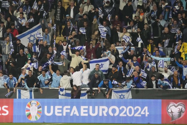 Israel supporters cheer during the Euro 2024 qualifying play-off soccer match between Israel and Iceland, at Szusza Ferenc Stadium in Budapest, Hungary, Thursday, March 21, 2024. (AP Photo/Darko Vojinovic)