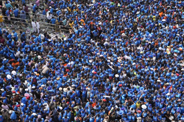Cricket fans arrive to watch the ICC Men's Cricket World Cup final match between Australia and India at Narendra Modi stadium in Ahmedabad, India, Sunday, Nov. 19, 2023. (AP Photo/Ajit Solanki)